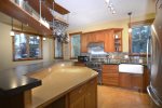 Modern Kitchen with Concrete Countertops and Bamboo Island